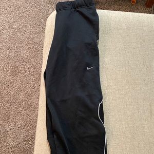 Black Nike Dri-fit Sweatpants with zipper ends.